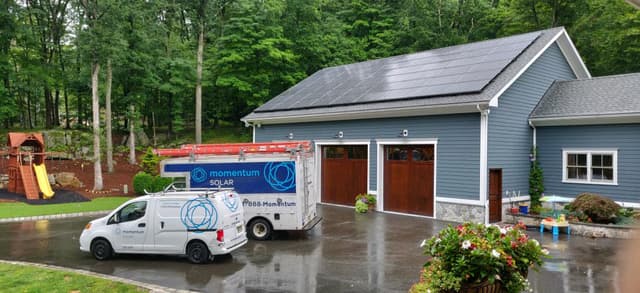 Professional solar installation with Momentum Solar van