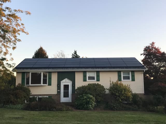 Professional solar installation on ranch house